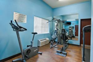 a gym with two exercise bikes in a room at Oxford Suites Hermiston in Hermiston