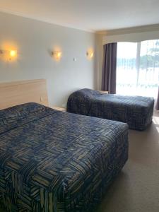 Postel nebo postele na pokoji v ubytování Shellharbour Resort and Conference Centre