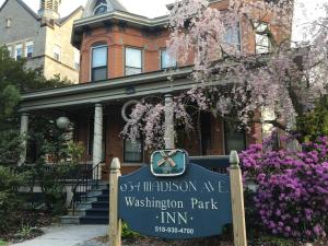 a house with a sign in front of it at Washington Park Inn in Albany