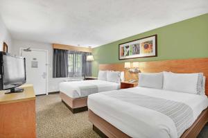 מיטה או מיטות בחדר ב-Hotel Nexus; BW Signature Collection