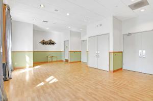a large room with a wooden floor and white walls at Hotel Nexus; BW Signature Collection in Seattle