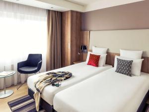 Postel nebo postele na pokoji v ubytování Mercure Hotel Nijmegen Centre