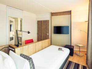 TV a/nebo společenská místnost v ubytování Mercure Hotel Nijmegen Centre