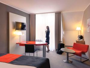 TV a/nebo společenská místnost v ubytování Mercure Residenz Frankfurt Messe