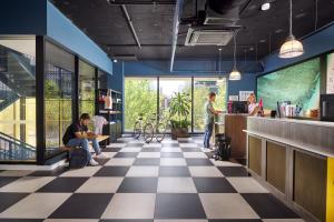 a restaurant with a checkered floor at Hostel G Perth in Perth
