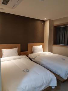 Postel nebo postele na pokoji v ubytování Hillside Hotel