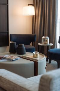 a living room with a couch and a table at SKYE Suites Green Square in Sydney