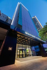 a building with a sign on the side of it at Mercure Nanjing Downtown in Nanjing