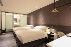 Katil atau katil-katil dalam bilik di City Suites - Taipei Nandong