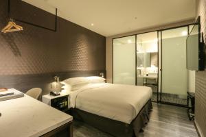 Katil atau katil-katil dalam bilik di City Suites - Taipei Nandong