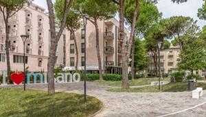 a red heart on a street in front of a building at Hotel Morotti in Misano Adriatico