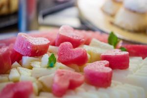 a close up of a plate of water melons and hearts at Vitalclass Lanzarote Resort in Costa Teguise