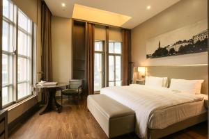 Katil atau katil-katil dalam bilik di City Suites - Taipei Nandong