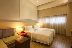 Katil atau katil-katil dalam bilik di City Suites - Taipei Nandong