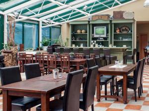Reštaurácia alebo iné gastronomické zariadenie v ubytovaní Apart Vivaldi