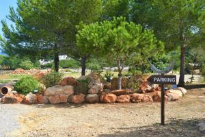 
a wooded area with several trees and shrubbery at Agroturismo Sa Marina - Adults Only in Cala Boix
