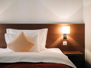 Ліжко або ліжка в номері Hotel Krone Thun