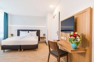 Postel nebo postele na pokoji v ubytování Hotel-Etage Apfelrot