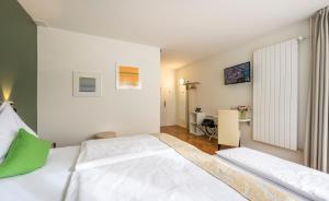 Ένα ή περισσότερα κρεβάτια σε δωμάτιο στο Hotel Oltnerhof - Self Check in