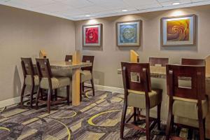 a waiting room with a table and chairs at La Quinta by Wyndham Naples East (I-75) in Naples