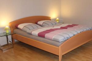 a bed with two pillows on it in a room at Ferienwohnung Meyer, 35176 in Schwerinsdorf