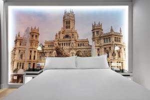 Кровать или кровати в номере Elba Madrid Alcalá