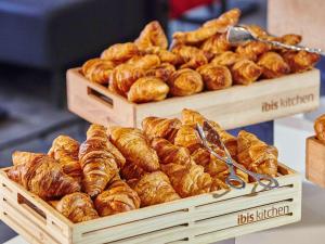 two wooden boxes filled with lots of croissants at ibis Paris CDG Airport in Roissy-en-France