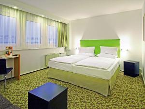 Rúm í herbergi á ibis Dresden Zentrum