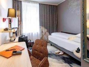 Postel nebo postele na pokoji v ubytování Mercure München am Olympiapark