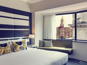 Postel nebo postele na pokoji v ubytování Mövenpick Hotel Auckland