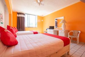 Ένα ή περισσότερα κρεβάτια σε δωμάτιο στο OYO Hotel Casino Del Valle, Matehuala