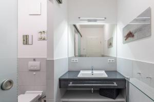a bathroom with a sink and a mirror at Residenz Am Meer in Börgerende-Rethwisch