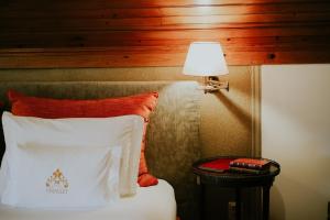 Cama ou camas em um quarto em Challet Fonte Nova