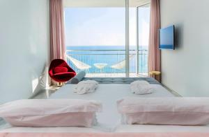 Postel nebo postele na pokoji v ubytování Hotel Aromar
