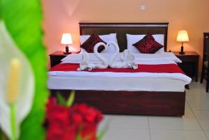 Postel nebo postele na pokoji v ubytování Al Qidra Hotel & Suites Aqaba