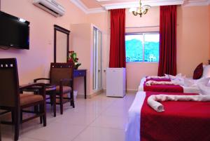 Postel nebo postele na pokoji v ubytování Al Qidra Hotel & Suites Aqaba