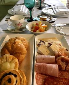 a table with two trays of different types of food at Trunkwell House Hotel in Reading