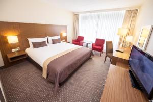 TV a/nebo společenská místnost v ubytování Hotel De Bilderberg