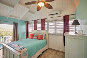 a bedroom with a bed and a ceiling fan at St Croix Home with Caribbean Views - 1 Mi to Beach in La Vallee