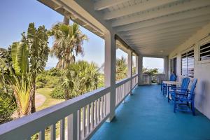 a porch of a house with chairs and a table at St Croix Home with Caribbean Views - 1 Mi to Beach in La Vallee