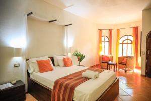 Giường trong phòng chung tại Manala Hotel