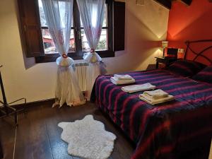 Postel nebo postele na pokoji v ubytování Apartamentos El Rincon Encantado