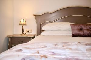 Postel nebo postele na pokoji v ubytování Agriturismo Casale ai Prati
