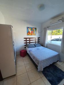 Postel nebo postele na pokoji v ubytování Apartamento próximo ao Aeroporto de Florianópolis.