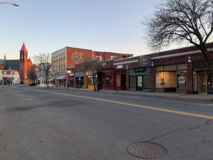 an empty street in a small town with buildings at The Cabot Lodge in Beverly