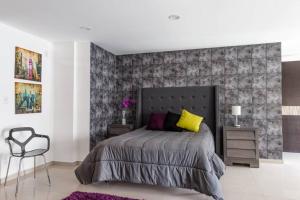 Un pat sau paturi într-o cameră la Increible Loft en PH Zona Polanco B