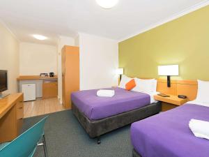 Ένα ή περισσότερα κρεβάτια σε δωμάτιο στο ibis Styles Geraldton