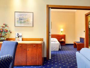Posteľ alebo postele v izbe v ubytovaní Mercure Reggio Emilia Centro Astoria