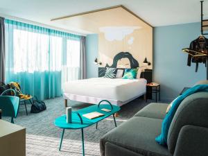 Säng eller sängar i ett rum på ibis Styles Louvain-la-Neuve Hotel and Events