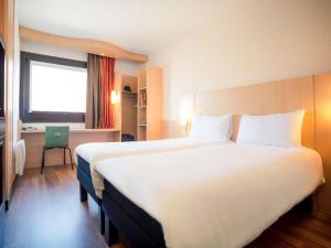 Postel nebo postele na pokoji v ubytování ibis Grenoble Gare